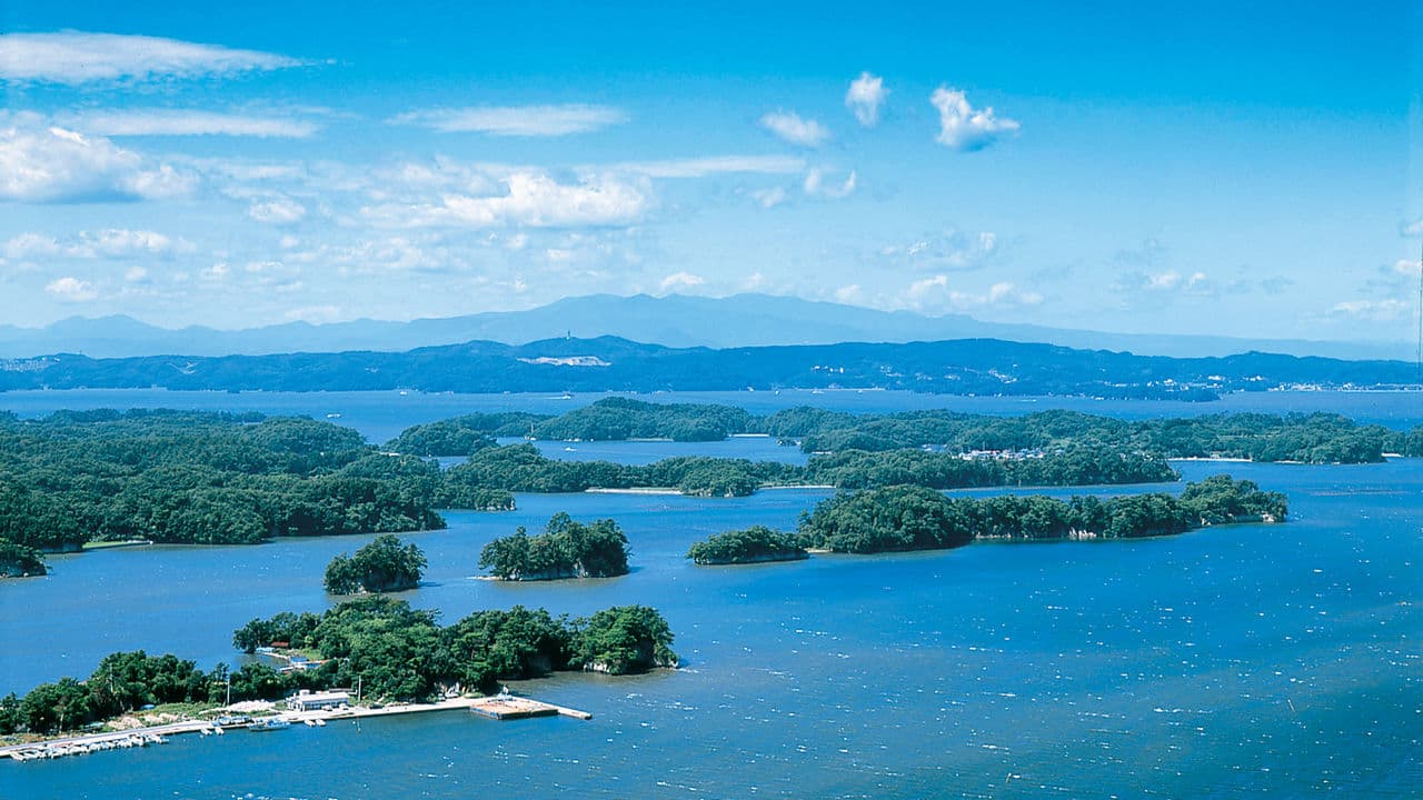 Matsushima Bay in miyagi, Japan - One of Japan's Three Great Views, featuring over 260 pine-covered islands scattered across a tranquil bay, best experienced by sightseeing boat with views of picturesque temples and natural beauty.
