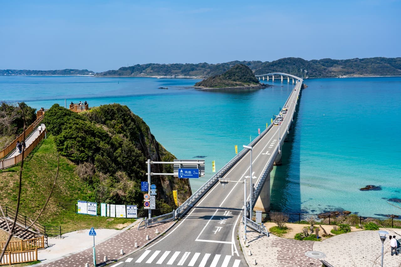 Tsunoshima Bridge & Beach in yamaguchi, Japan - Spectacular 1.8-kilometer bridge arching over emerald waters to Tsunoshima Island, featuring white sand beaches and scenic coastal drives.