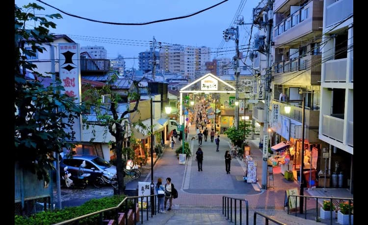 Yanaka Ginza Old Town in tokyo, Japan - A nostalgic shopping street preserving Tokyo's Showa-era atmosphere with traditional shops, cat-themed culture, and the famous sunset steps.