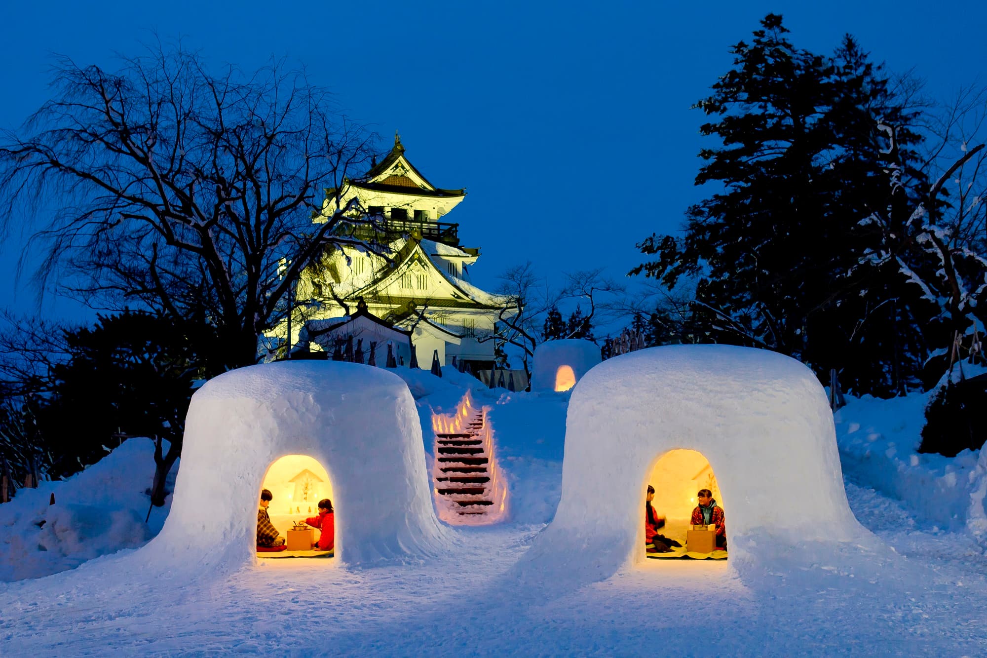 Yokote Kamakura Snow Festival in akita, Japan - A 450-year-old winter tradition featuring hundreds of igloo-like snow houses where children serve amazake and mochi, creating one of Japan's most enchanting winter festivals.