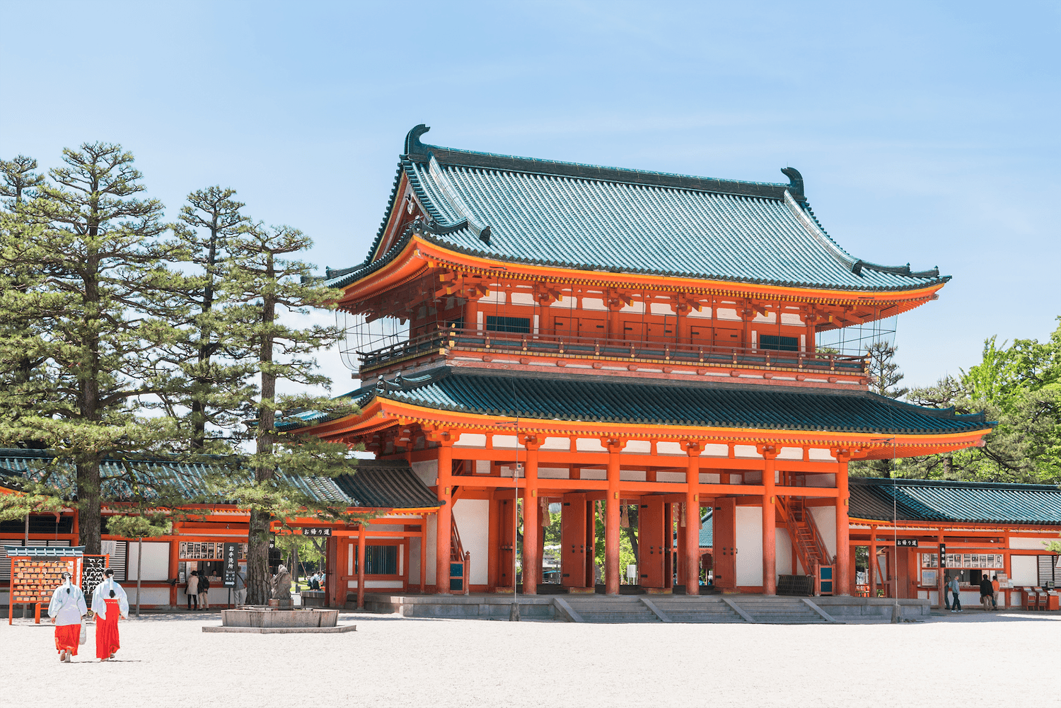 Heian Jingu Shrine in kyoto, Japan - Vibrant vermillion shrine with massive torii gate and spectacular gardens featuring cherry blossoms, azaleas, and water lilies across four distinct sections.