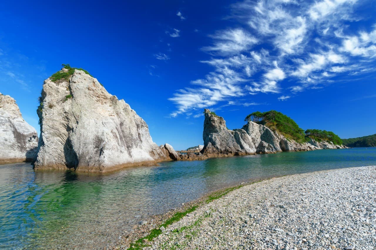 Miyako Jodogahama Beach in iwate, Japan - A breathtaking coastal paradise featuring dramatic white rock formations, crystal-clear emerald waters, and pristine pebble beaches, named 'Pure Land Beach' by a monk who compared it to Buddhist heaven.