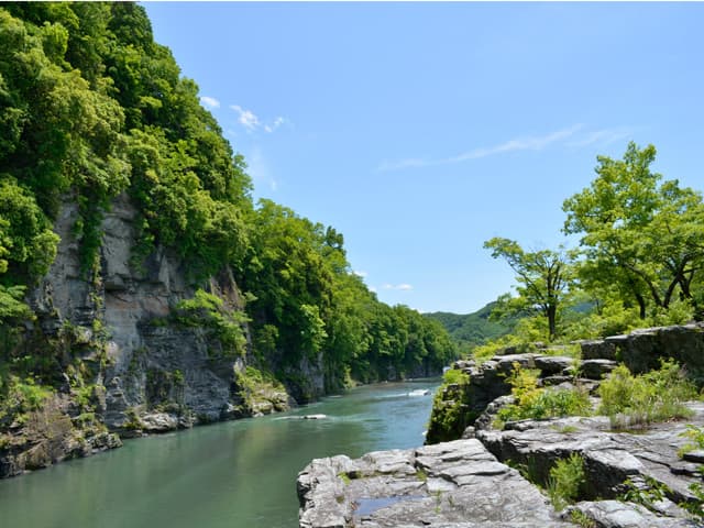 Nagatoro River & Iwadatami in saitama, Japan - A scenic river gorge featuring unique layered rock formations called 'Iwadatami' resembling tatami mats, best explored by traditional boat rides and riverside walks through crystalline schist cliffs.