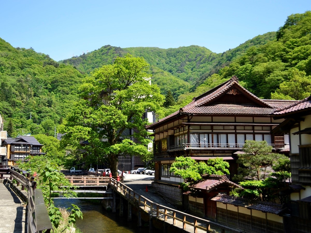 Aizu Higashiyama Onsen in fukushima, Japan - A 1,300-year-old hot spring town in the mountains near Aizu-Wakamatsu, known for healing waters, traditional ryokan, and connections to the tragic White Tiger Brigade samurai story.