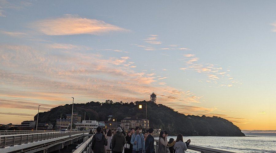 Enoshima Island in kanagawa, Japan - A small island resort connected by bridge to the mainland, offering beaches, shrines, caves, an observation tower, and stunning views of Mt. Fuji across Sagami Bay.