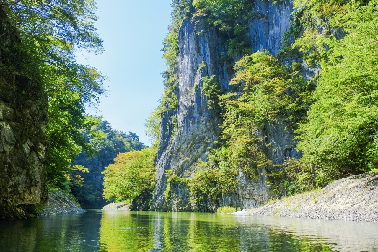 Geibikei Gorge in iwate, Japan - A spectacular limestone gorge carved over 100 million years, best explored by traditional flat-bottomed boat rides through dramatic 100-meter high cliffs along the crystal-clear Satetsu River.