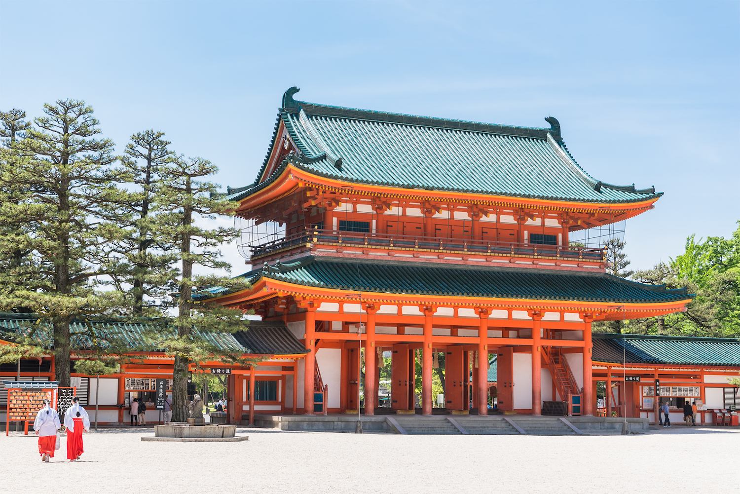 Heian Jingu Shrine in kyoto, Japan - Vibrant vermillion shrine with massive torii gate and spectacular gardens featuring cherry blossoms, azaleas, and water lilies across four distinct sections.