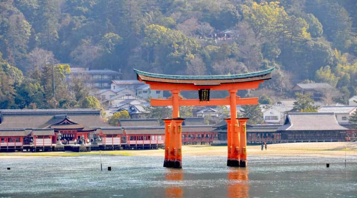 Itsukushima Shrine in hiroshima, Japan - A UNESCO World Heritage Site famous for its iconic floating torii gate that appears to rise from the sea during high tide.