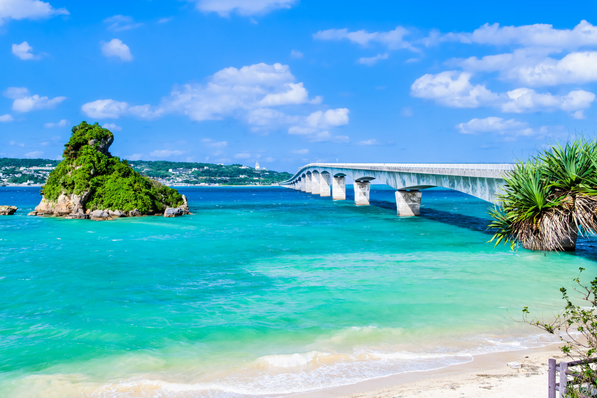 Kouri Island in okinawa, Japan - Small romantic island connected by a spectacular 2km bridge offering emerald waters, pristine beaches, and Okinawan legend as the birthplace of humanity.
