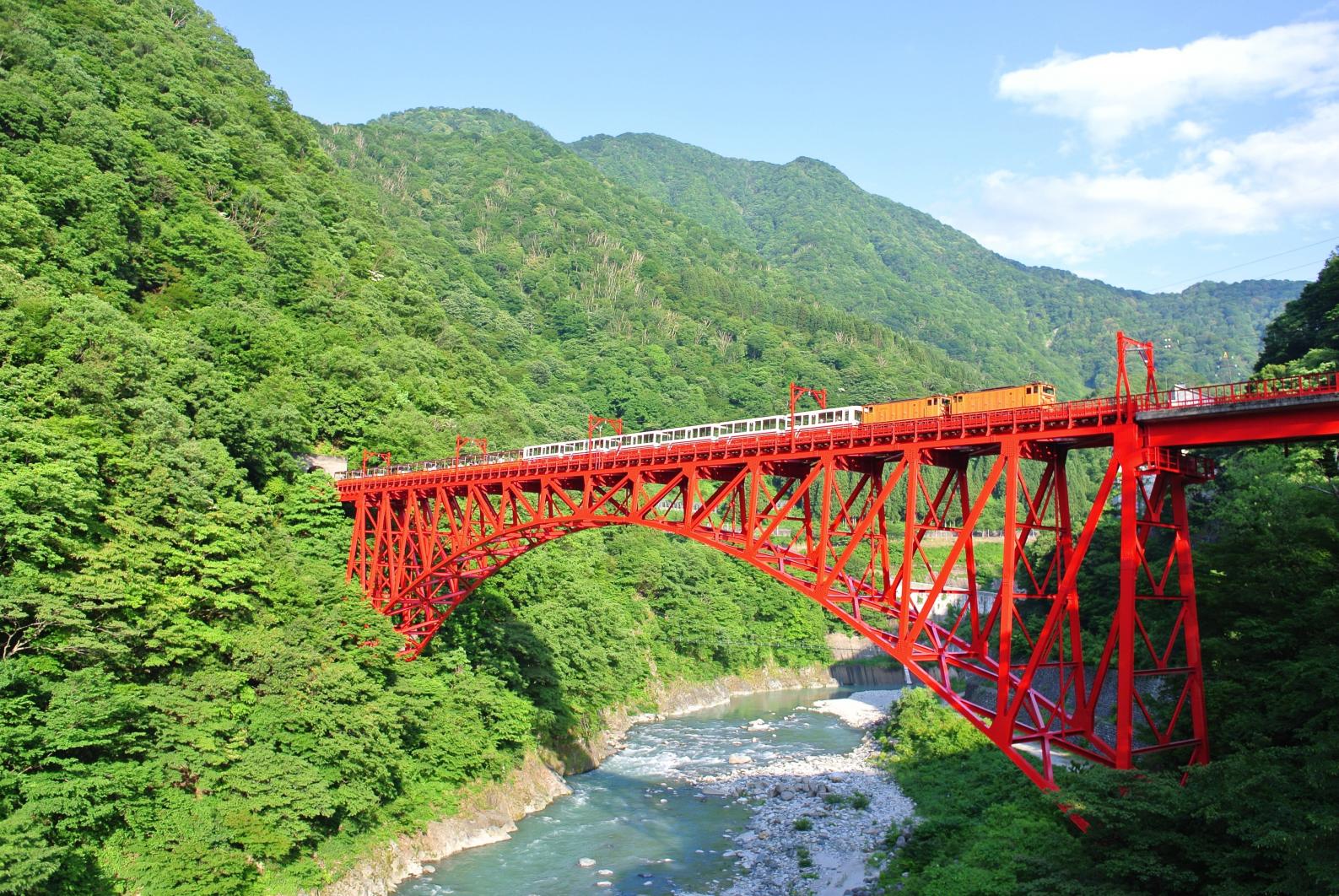 Kurobe Gorge Railway in toyama, Japan - Scenic trolley train journey through one of Japan's deepest gorges, offering spectacular mountain views and seasonal beauty from spring to autumn.