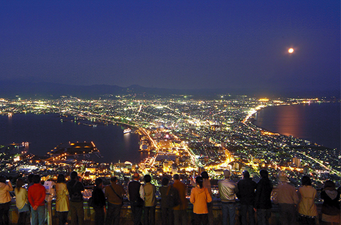 Mt. Hakodate Night View in hokkaido, Japan - One of Japan's three most famous night views, featuring the distinctive symmetrical cityscape of Hakodate spread across a narrow peninsula. The view from the 334-meter summit is particularly stunning when city lights reflect on the surrounding seas.
