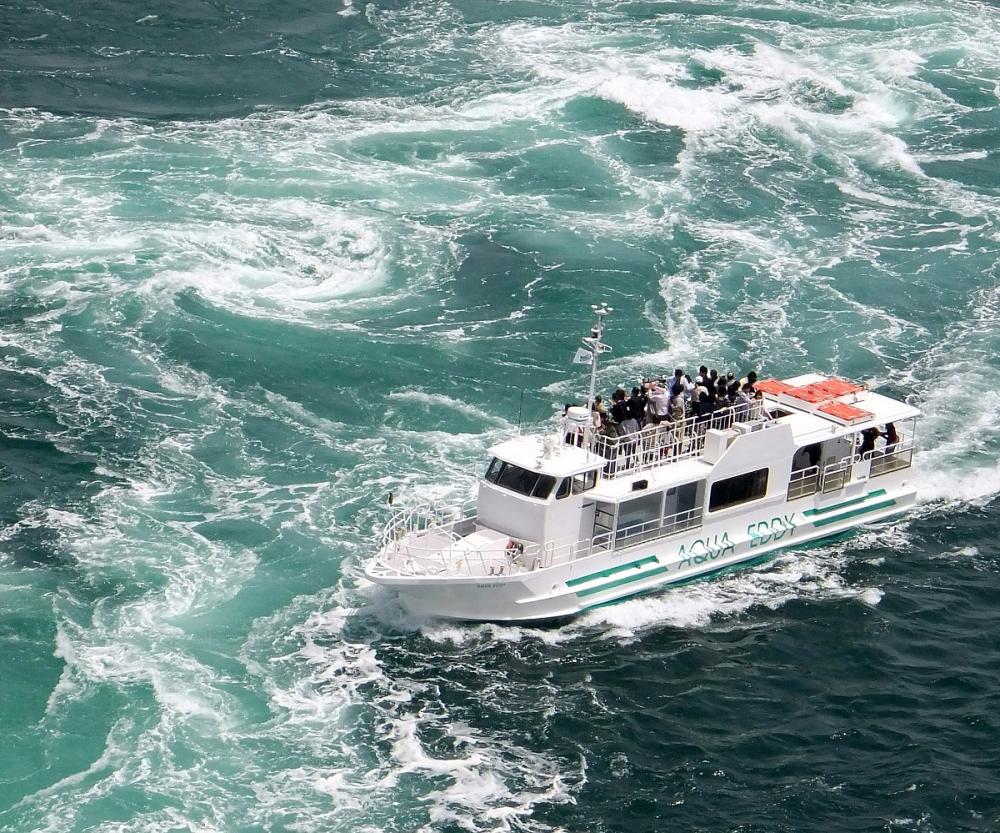 Naruto Whirlpools in tokushima, Japan - Spectacular natural whirlpools reaching 20 meters diameter in Naruto Strait, viewed from bridge walkways and sightseeing boats.