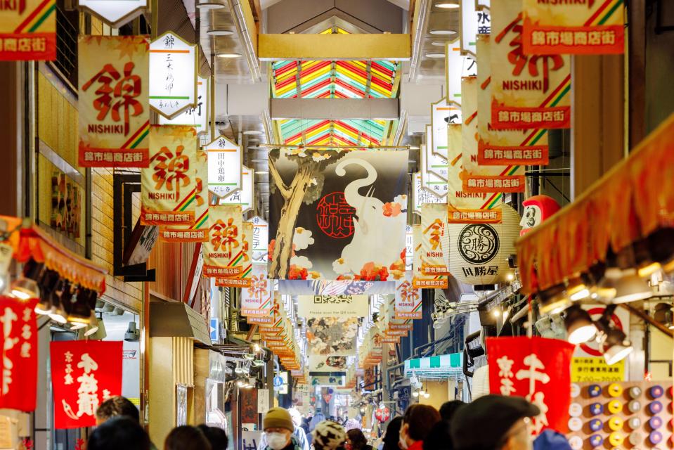 Nishiki Market in kyoto, Japan - Kyoto's famous 400-year-old food market offering traditional ingredients, prepared foods, and local specialties in a narrow covered arcade.