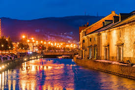 Otaru Canal in hokkaido, Japan - A historic waterway lined with preserved warehouses, representing Otaru's prosperous herring fishing era. The canal is especially romantic at dusk when gas lamps illuminate the stone-paved paths.