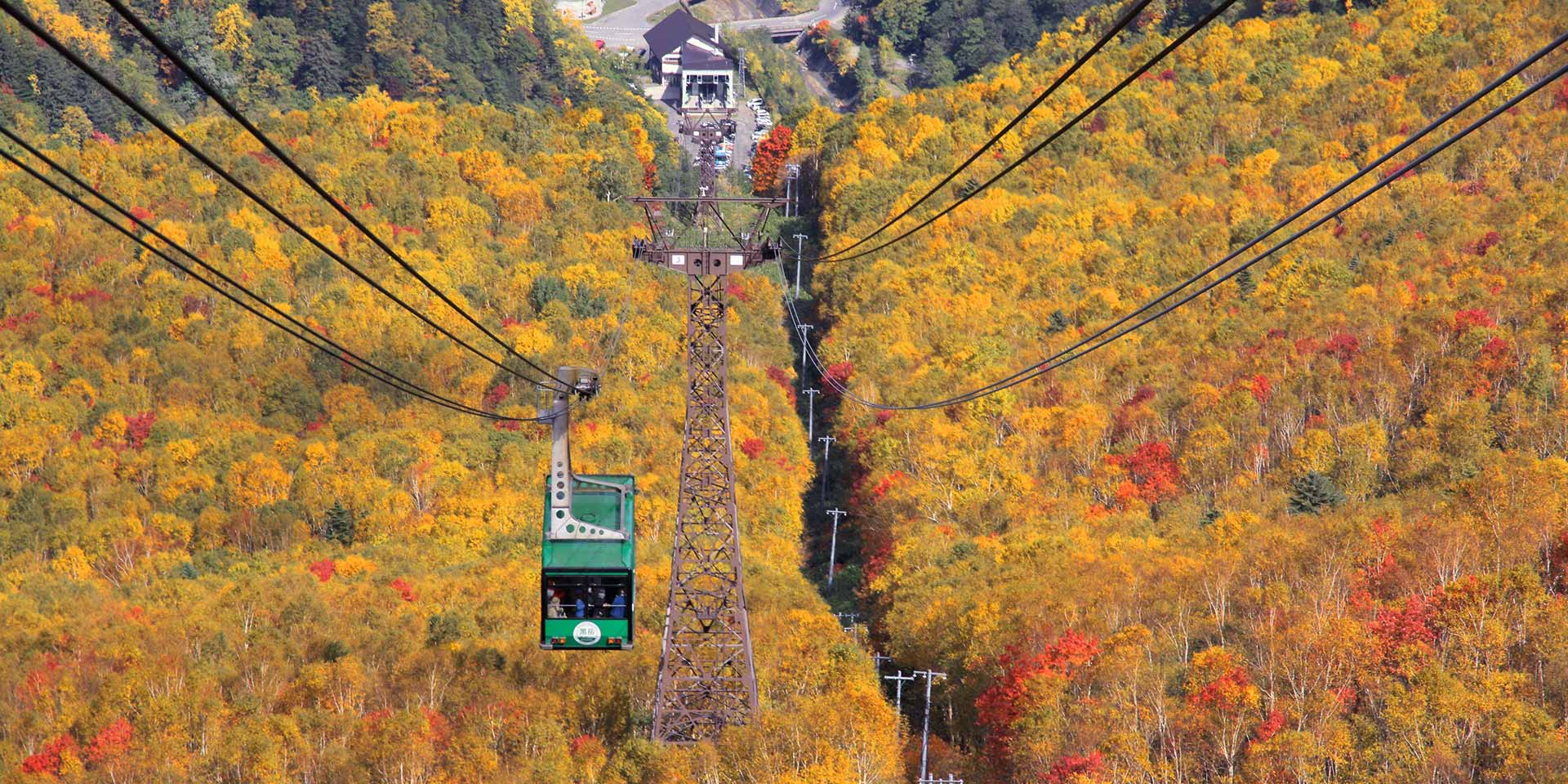 Sounkyo Gorge in hokkaido, Japan - A dramatic 24-kilometer gorge featuring 150-200 meter columnar basalt cliffs, spectacular waterfalls, and serving as the gateway to Daisetsuzan National Park.