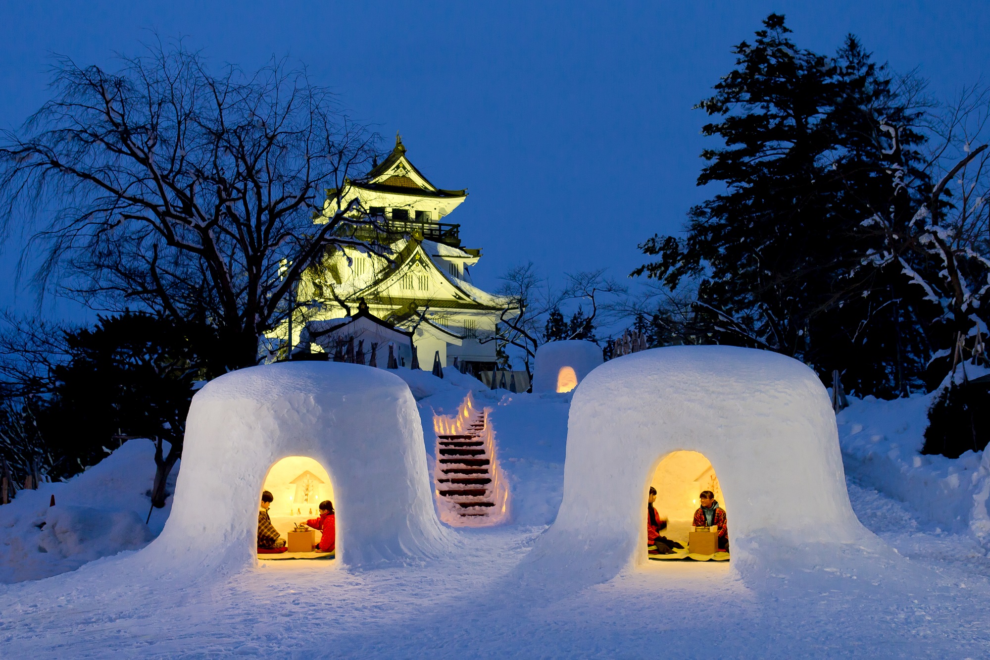 Yokote Kamakura Snow Festival in akita, Japan - A 450-year-old winter tradition featuring hundreds of igloo-like snow houses where children serve amazake and mochi, creating one of Japan's most enchanting winter festivals.